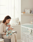Stork And Baby newborn 5 piece set with a white long-sleeve top and zoo-themed pants and hat.