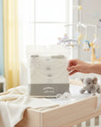 Stork And Baby white 3-pack long sleeve bodysuits for newborns, made of soft cotton for comfort.