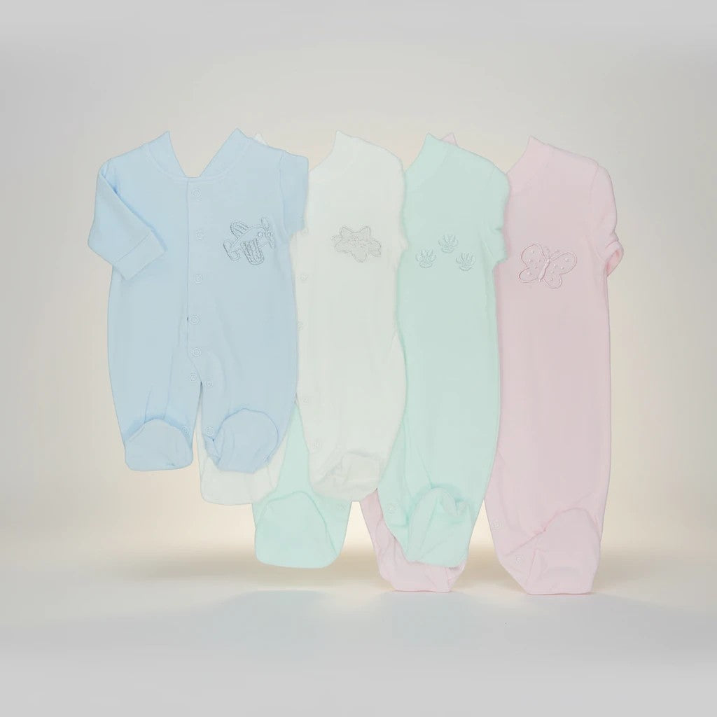 Stork And Baby pastel babygrows in blue, white, mint, and pink. 100% cotton with embroidered airplane, flower, leaves, and butterfly.