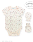Stork And Baby peach cotton interlock babygrow with cherry print, includes matching mittens. Short sleeves, envelope neckline.