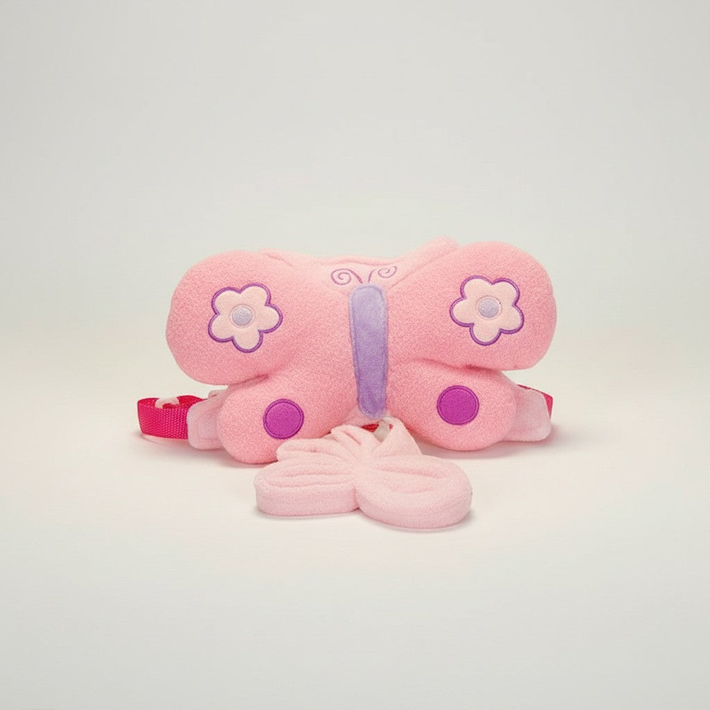 Stork And Baby pink plush butterfly harness with purple accents and flower details. Includes a detachable butterfly accessory.