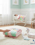 Stork and Baby pink cutwork blanket with house applique, soft fleece material, perfect for infants.