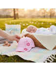 Stork And Baby pink embroidered flower baseball cap for girls, soft and comfortable fit.