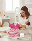 Stork and Baby pink polka dot and striped infant romper with ruffled waist and bow detail