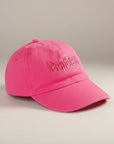 Stork And Baby bright pink cotton cap with embroidered "Princess" text and crown detail. Comfortable fit for girls.