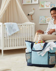 Stork And Baby blue plain diaper bag with organized compartments and mesh pockets, perfect for baby essentials.