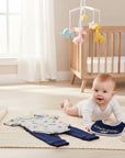 Stork And Baby 'Rawr-Some' 3 piece baby outfit with grey dinosaur print bodysuit, navy pants, and navy bib.