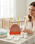 Stork And Baby orange and grey striped knit baby hat with matching pants and socks