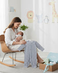 Stork And Baby blue and white striped babygrow with footies, perfect for baby boys. Soft cotton for comfort.