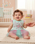 Stork And Baby mint green cotton bodysuit with pink and mint glitter skirt, featuring 'Sweet Little Girl' graphic.