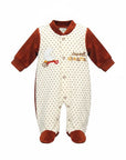 Stork And Baby cream velour baby grow with brown polka dots, moon embroidery and "sweet dreams" text.