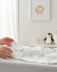 Stork And Baby white baby mittens made of soft cotton, perfect for newborns to prevent scratches.