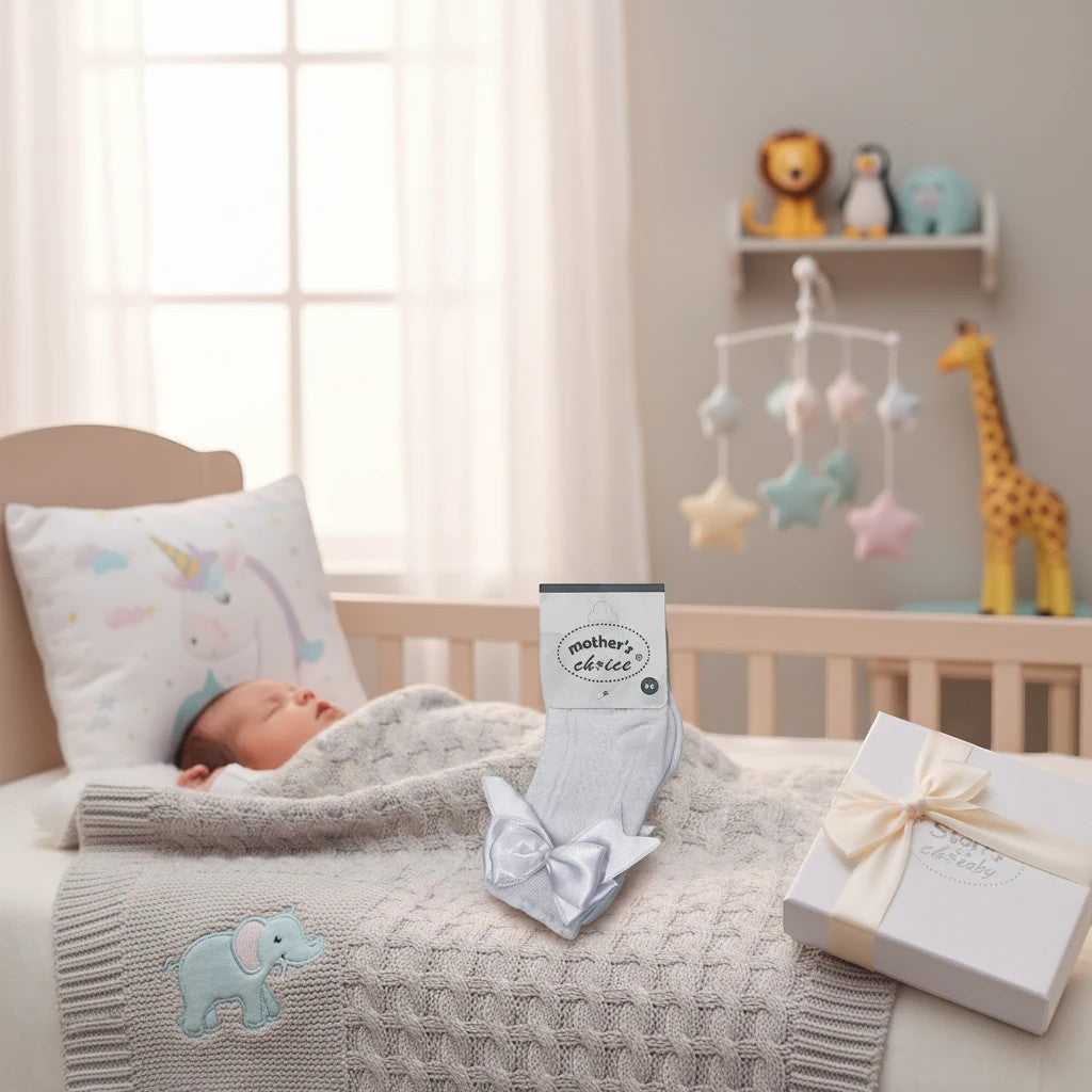 Stork And Baby white baby socks with satin bow detail, perfect for newborns 0-6 months.
