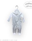 Stork And Baby white long-sleeve babygrow with all-over grey animal print and snap closures.