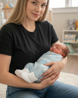 Stork And Baby white soft cotton booties for premature infants, designed for comfort and warmth.