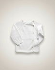 Stork And Baby white knit infant cardigan with button front and raglan sleeves. Soft and comfortable for babies.