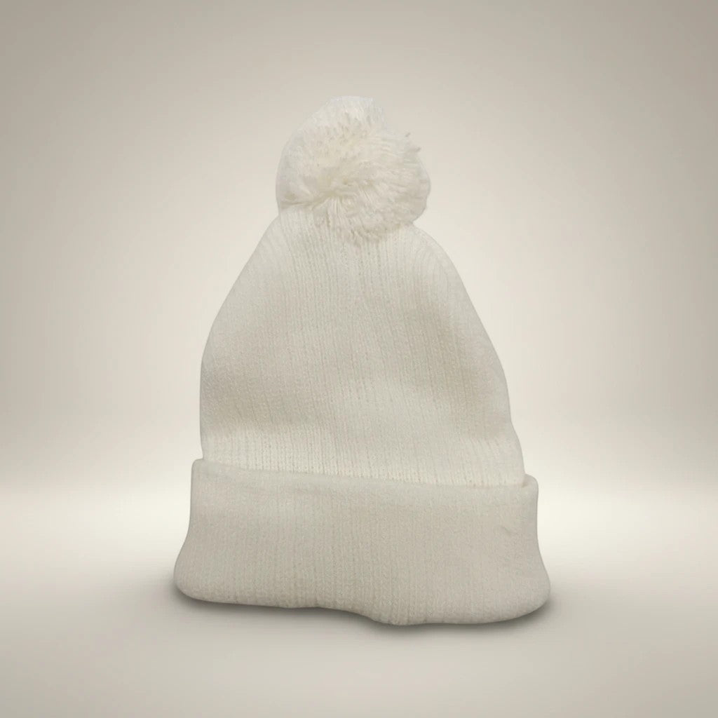 Stork And Baby white knit infant earflap hat with pom pom. Soft, cozy, and perfect for winter.