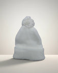 Stork And Baby white knit infant earflap hat with pom pom. Soft, cozy, and warm for winter.