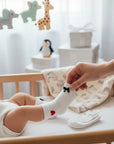 Stork And Baby white infant tights with red heart and black bow details, soft stretchy fit for comfort.