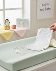 Stork And Baby white sleeveless infants bodyvest made of soft cotton, perfect for layering or warm days.