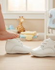 Stork And Baby white lace-up baby boots with a classic design, perfect for boys.