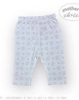 Stork And Baby white cotton blend baby leggings with a grey house and leaf pattern. Open feet design.