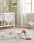 Stork and Baby white velour 3-piece set for infants, featuring a hat and booties with star embroidery.